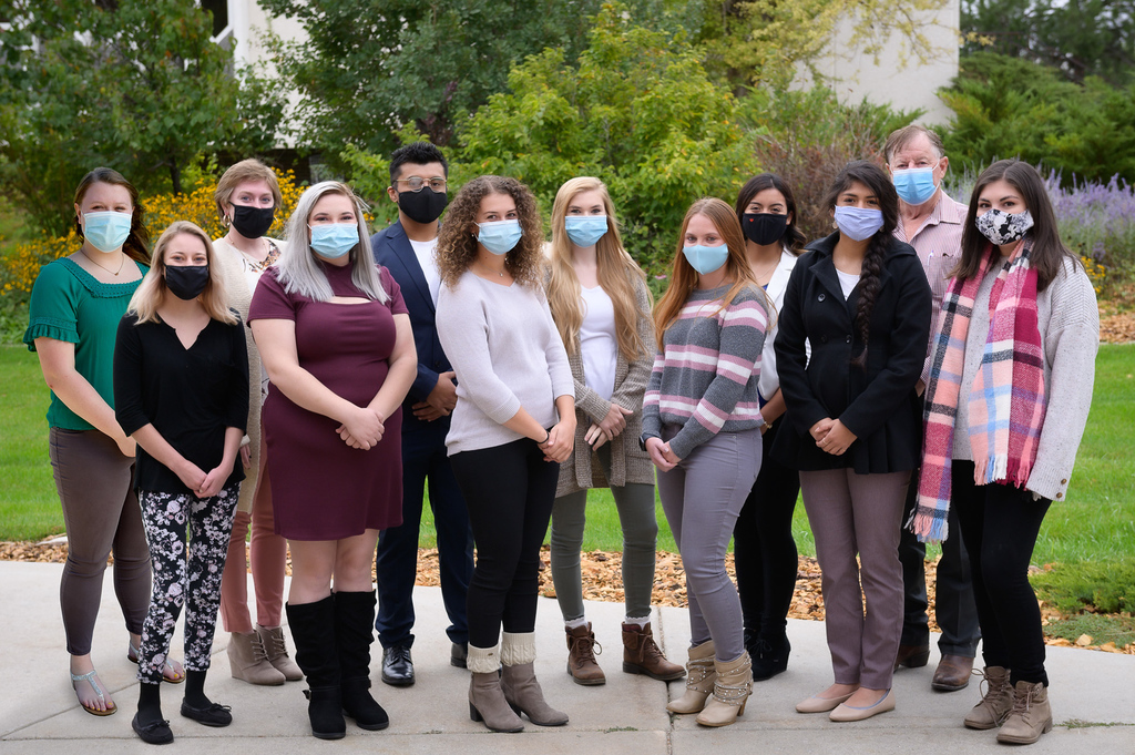 Senior social work class posed in masks.