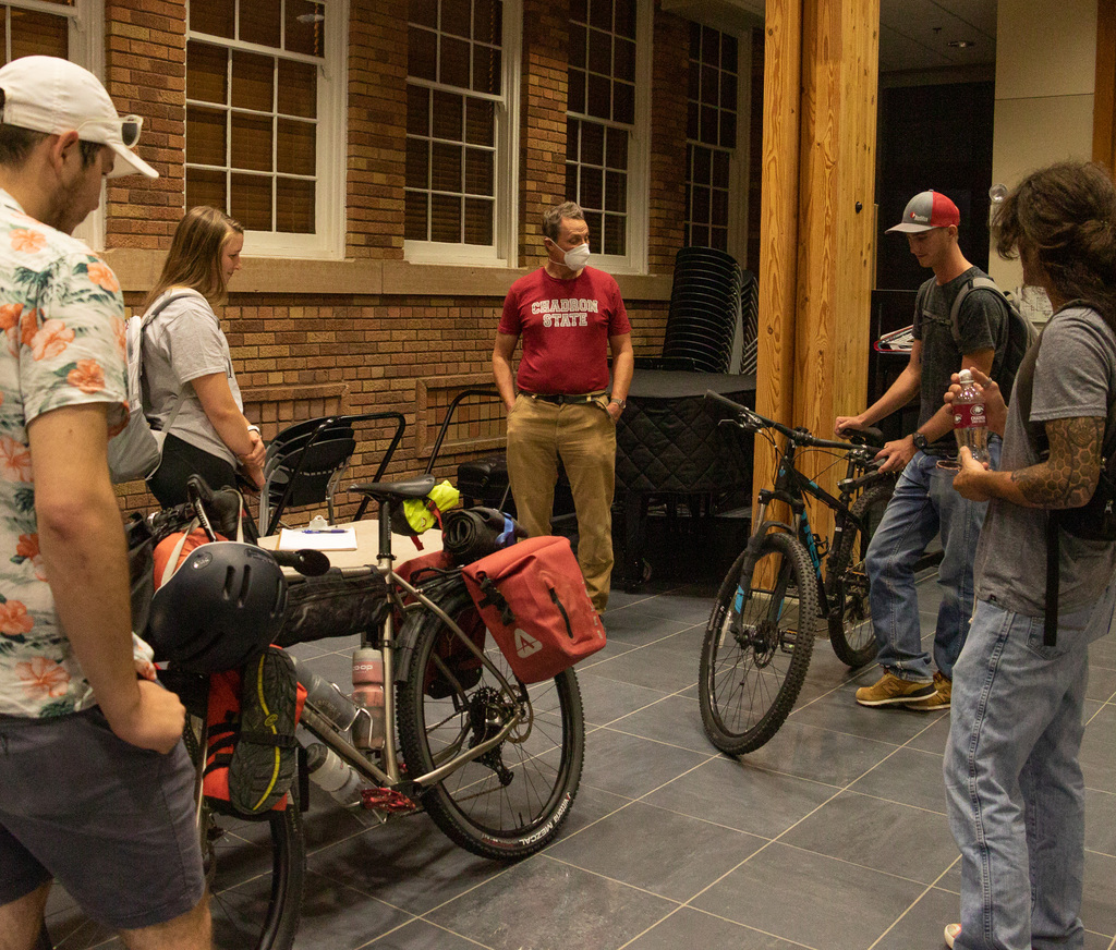 Dr. Kurt Kinbacher, Chadron State College History Professor, speaks with students
