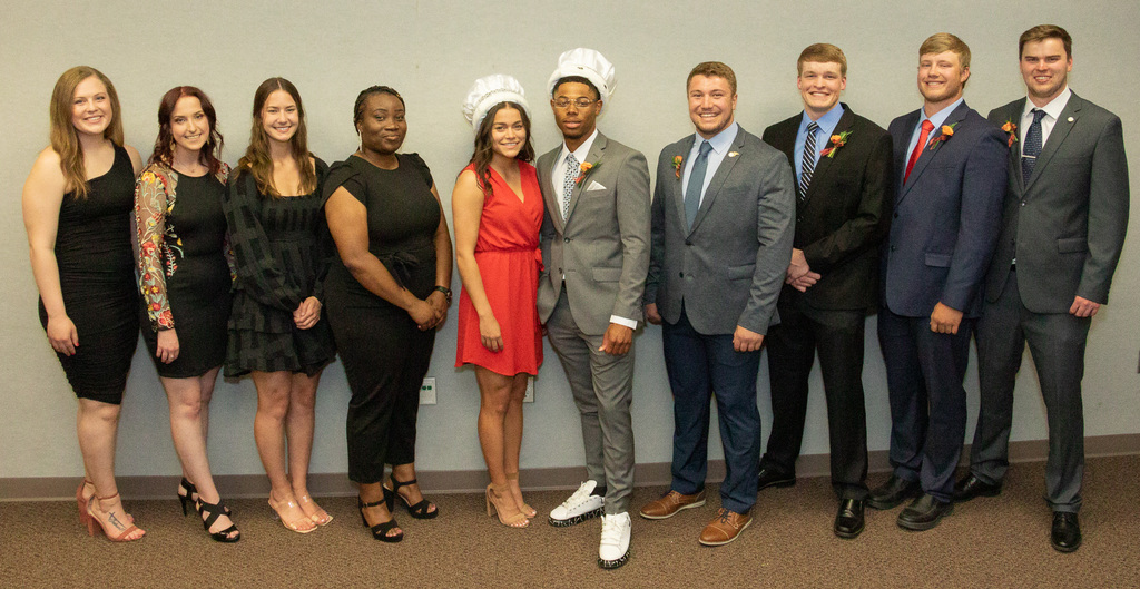 Ten students honored on Ivy Day pose for a photo