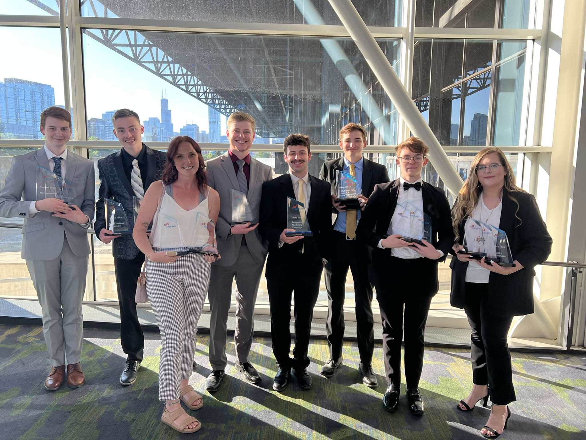 group posing with awards