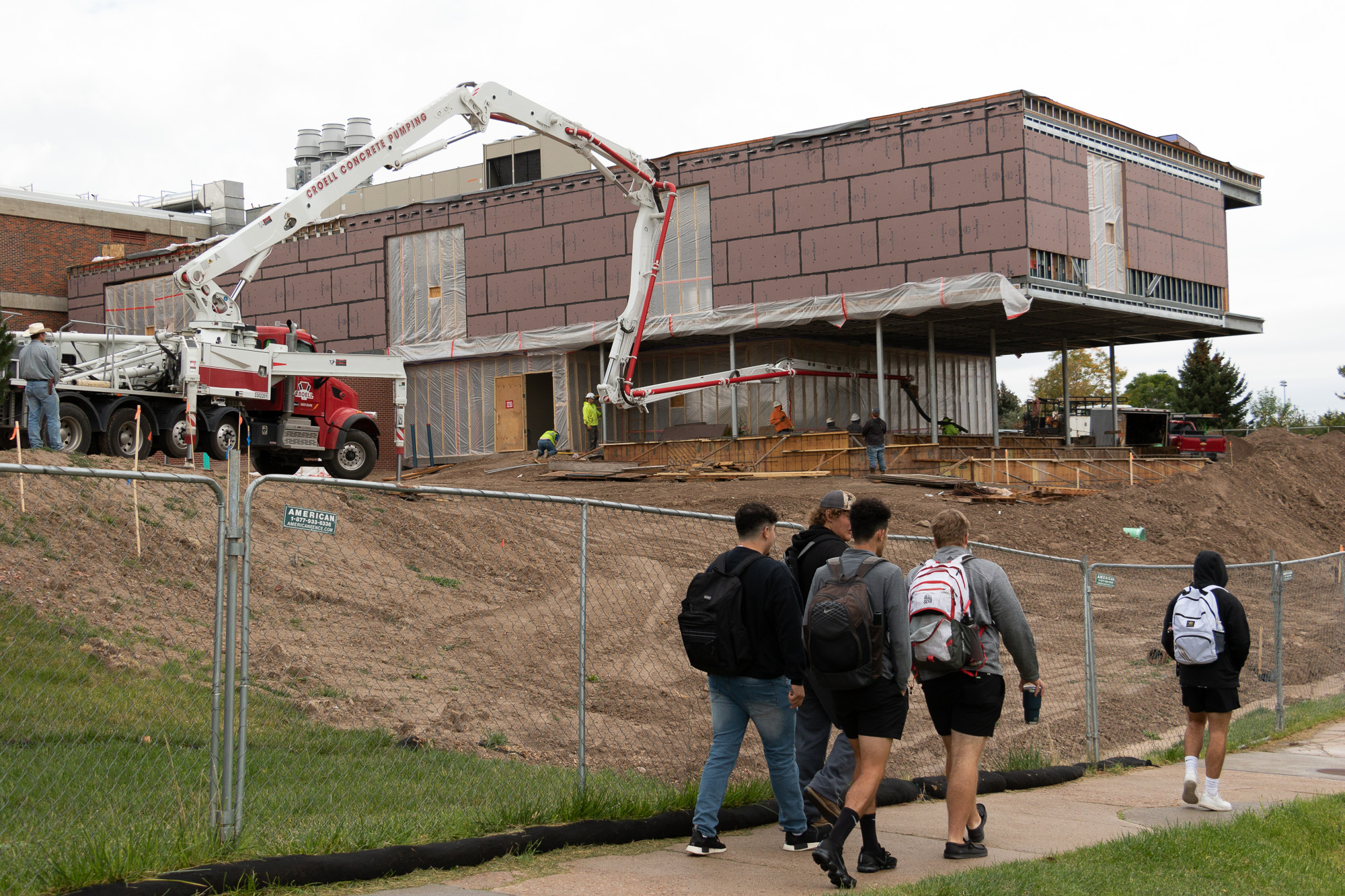 Students walking by Math Science COIL construction