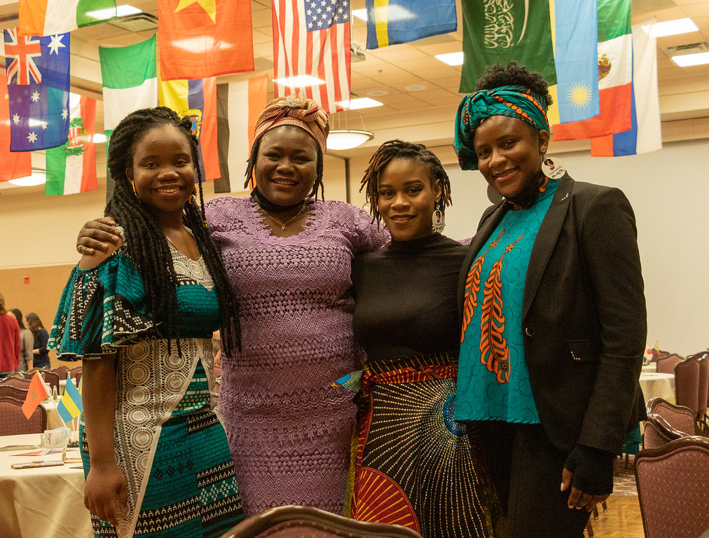 File photo of students and faculty posing at International Club Dinner