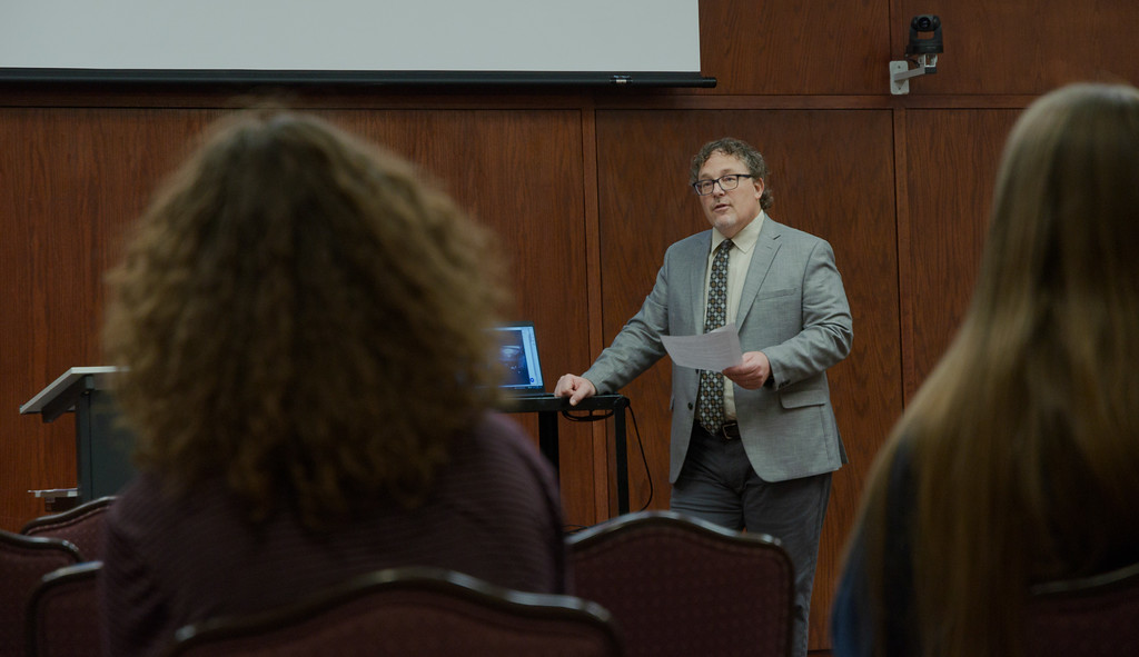 Professor lecturing to a group