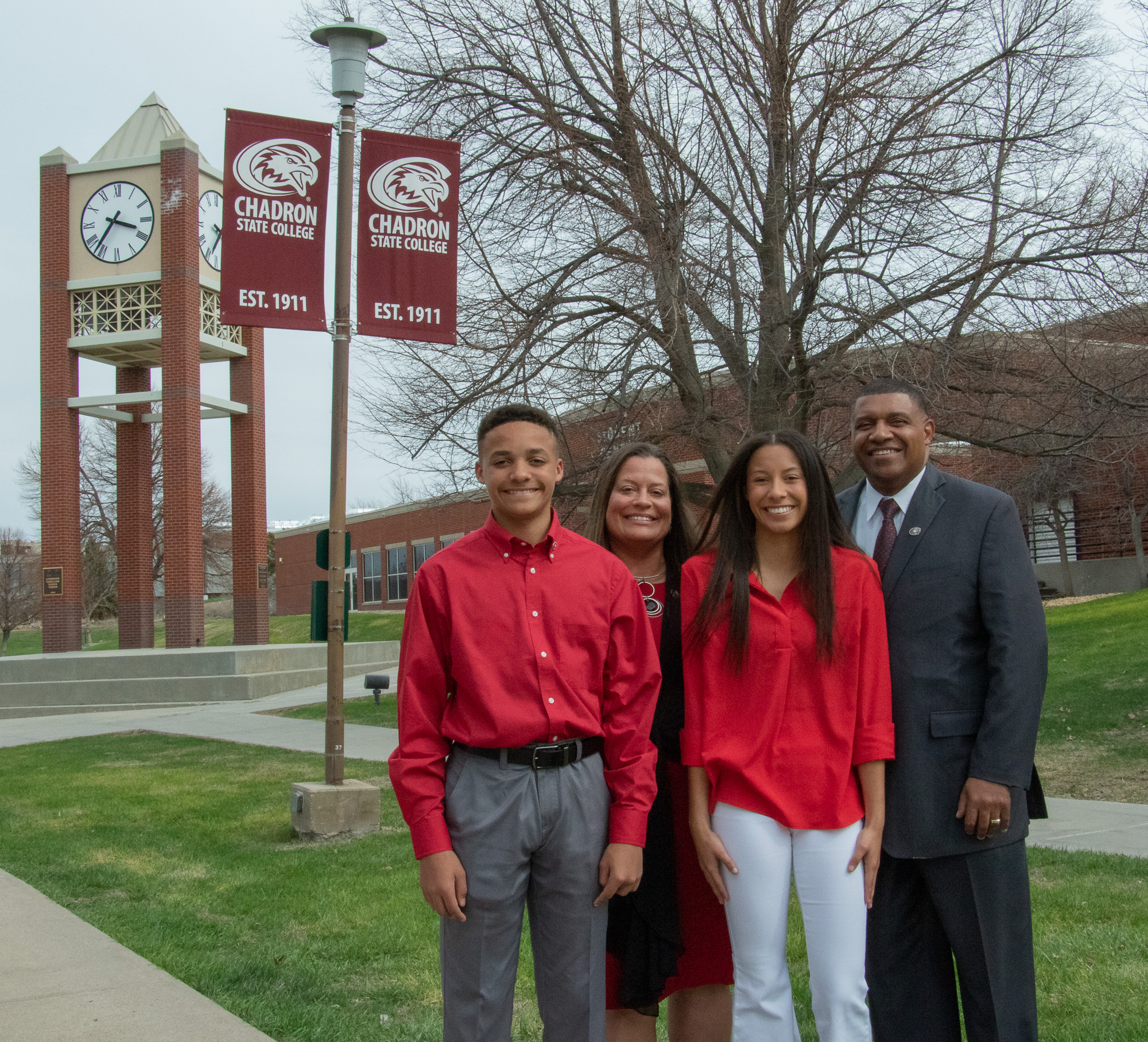 Four people standing outside
