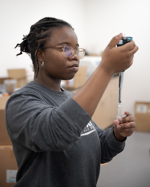 Woman conducting scientific lab experiment
