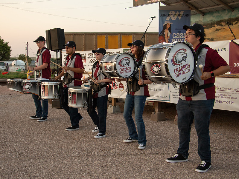 College student drum player performing outside