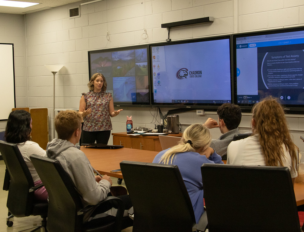Woman instructing a small group of students
