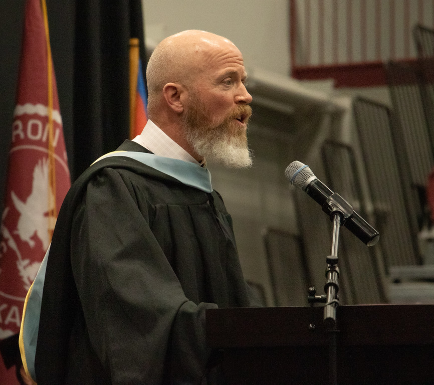 Adult male speaking at a podium