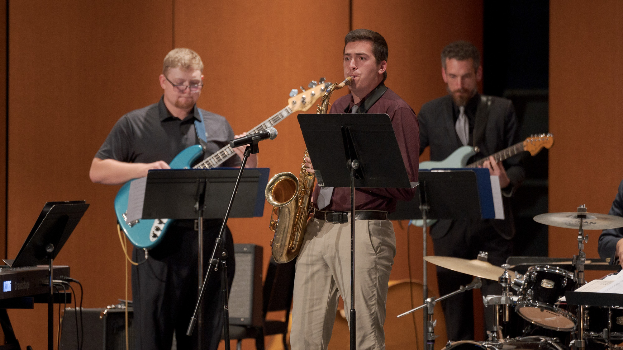 Cade Stephenson, center, performs a saxophone solo during the Jazz Band's performance of