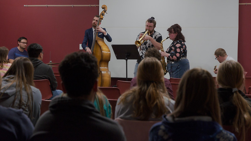 Professor and students playiing music