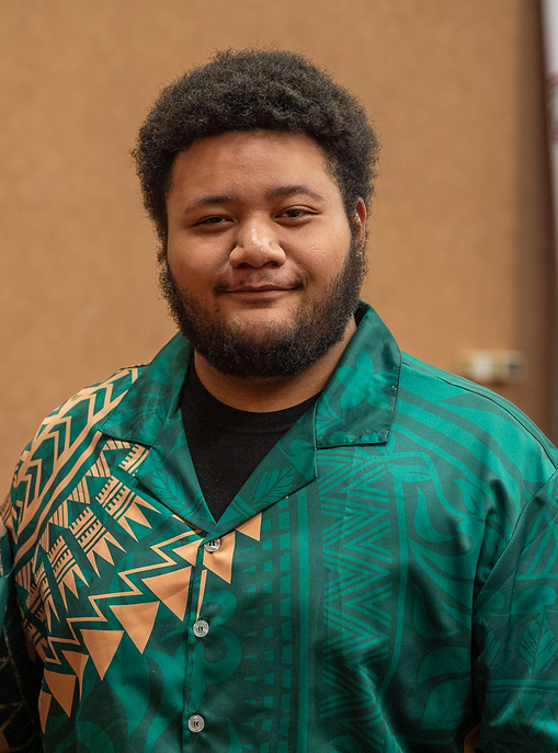 Male student posing inside
