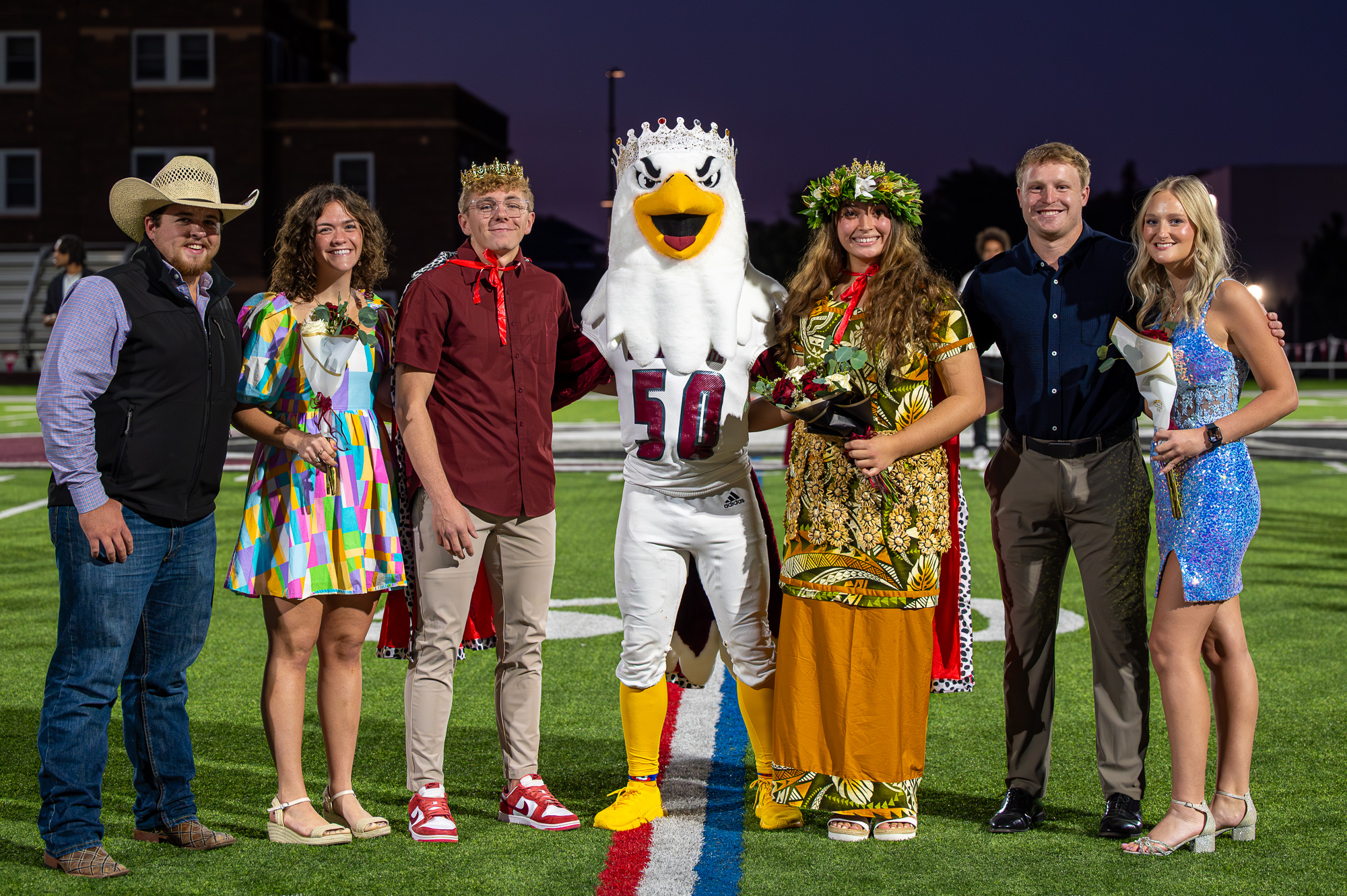 A group of students posing on the football field