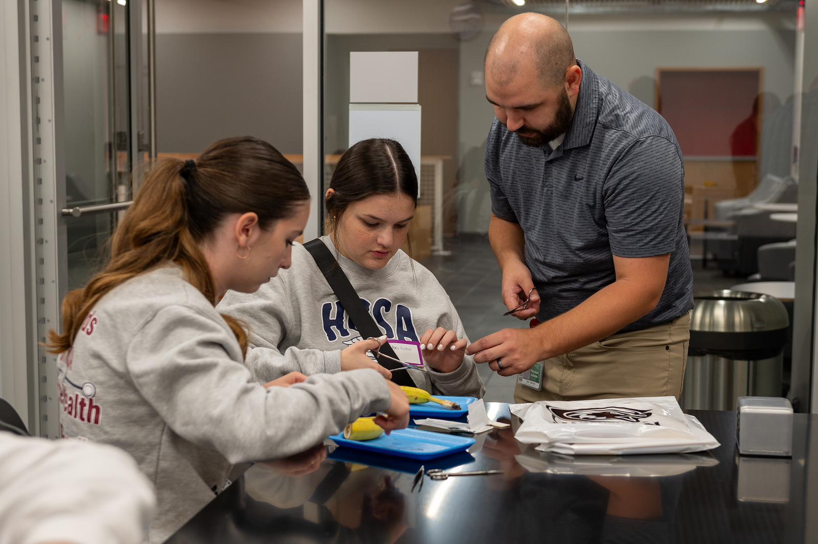 Health professional demonstrating a technique for students