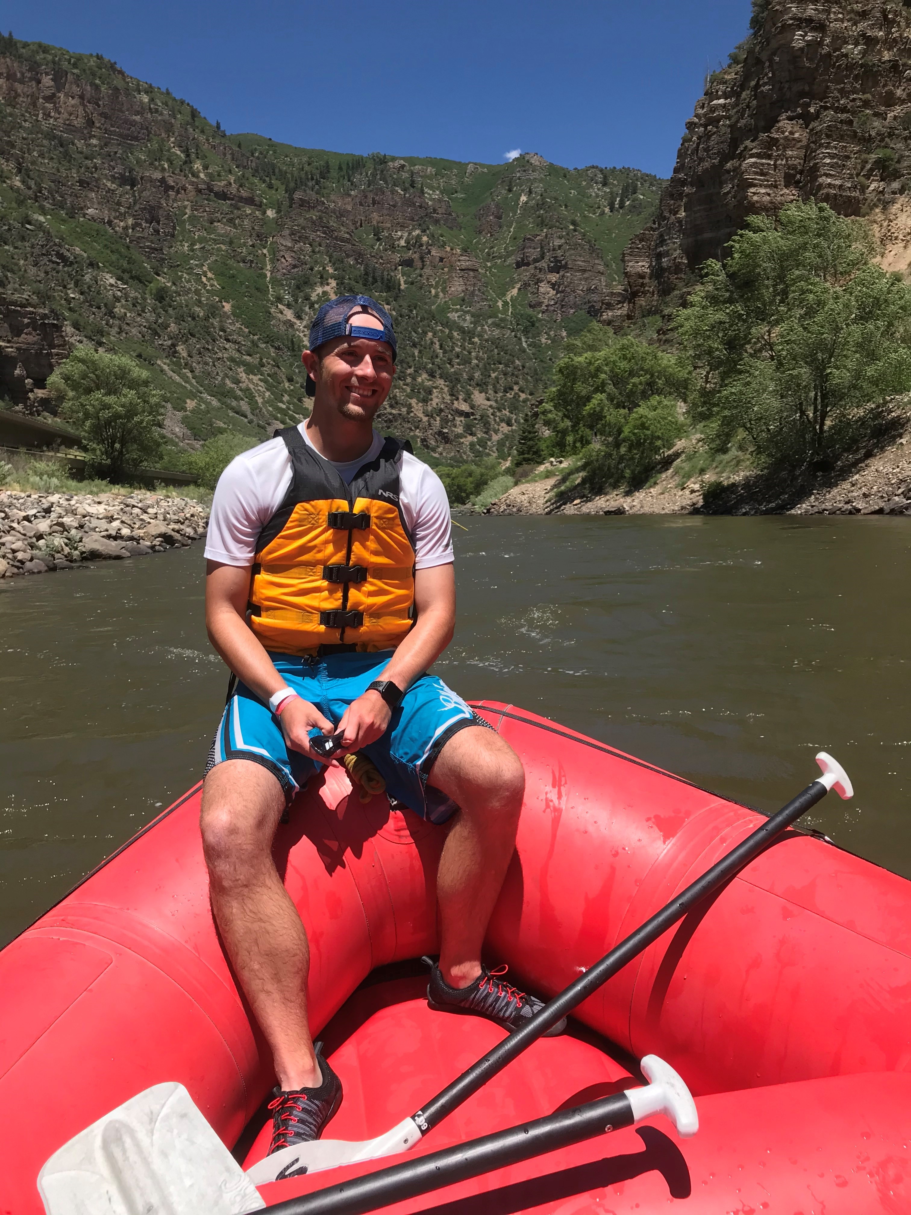 Man posing in a boat