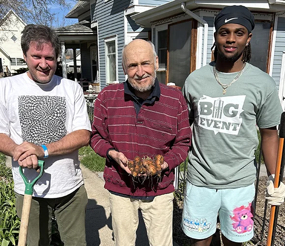 Three men smiling
