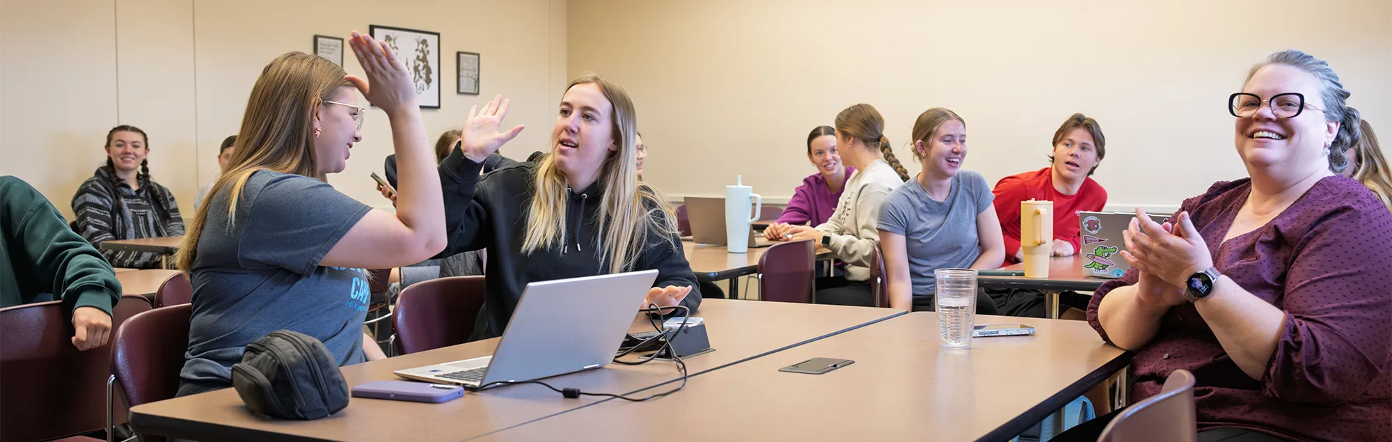 Psychological Sciences students and faculty engaged in a group discussion