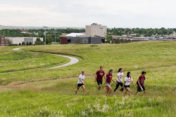 Students hike up C Hill